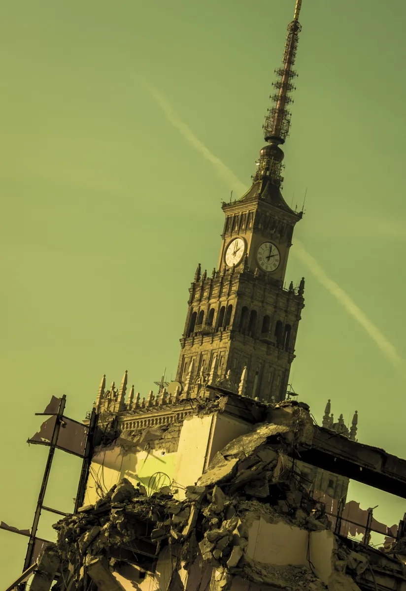 Palace of Culture and Science rising behind demolition rubble under a yellow sky